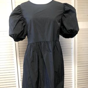 Divided black dress with balloon short sleeves.  Very light weight. Size L